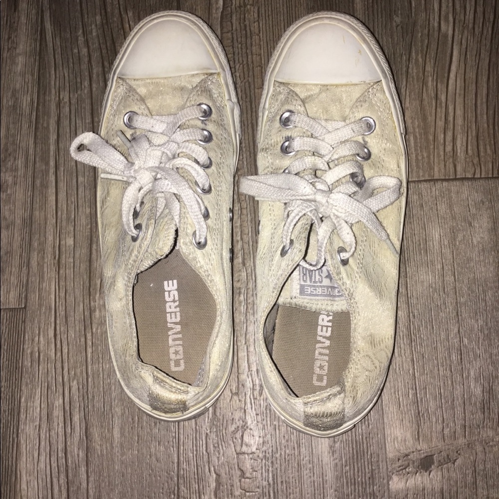 Cream collored converse.